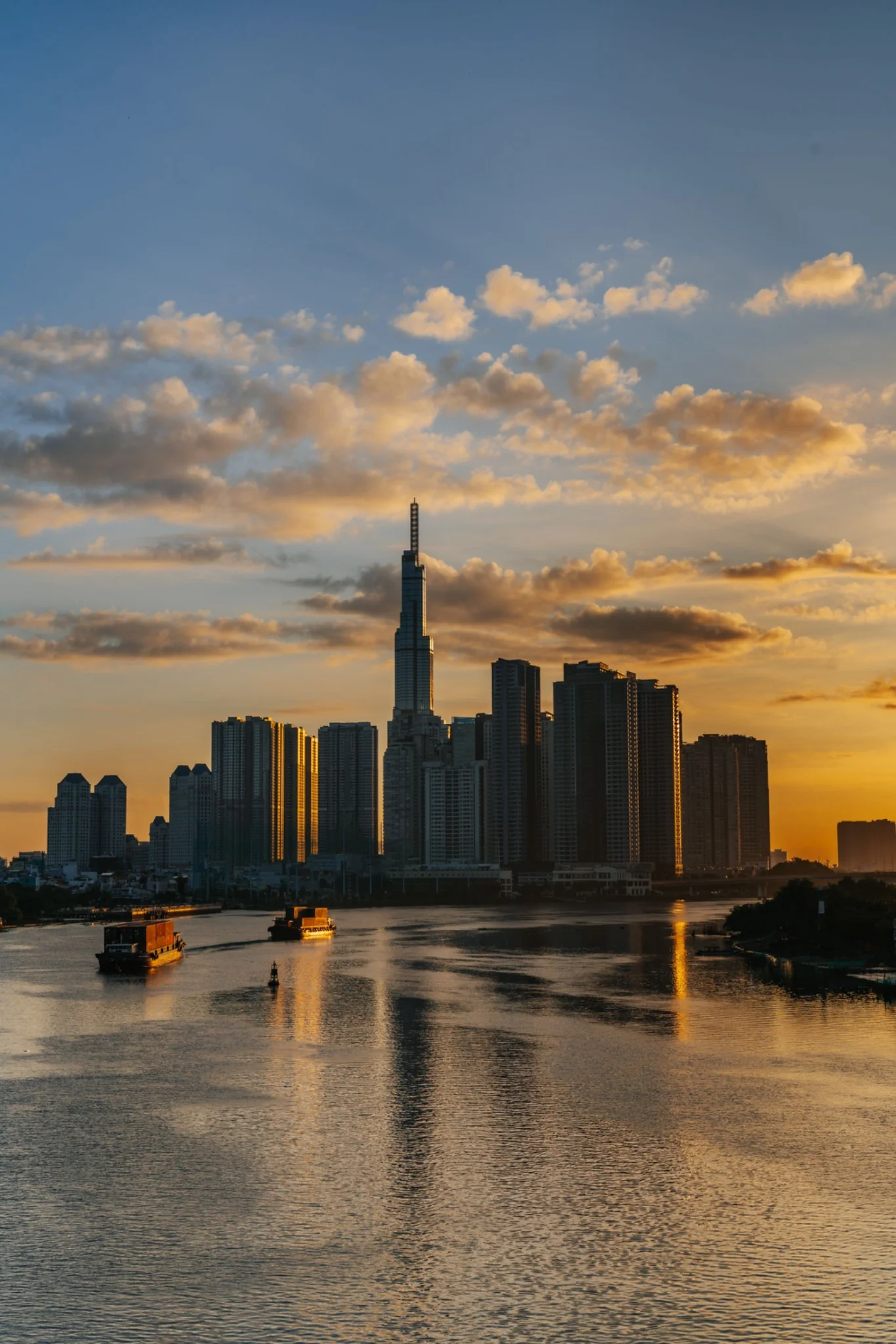Ho Chi Minh City skyline and river in the warm evening light